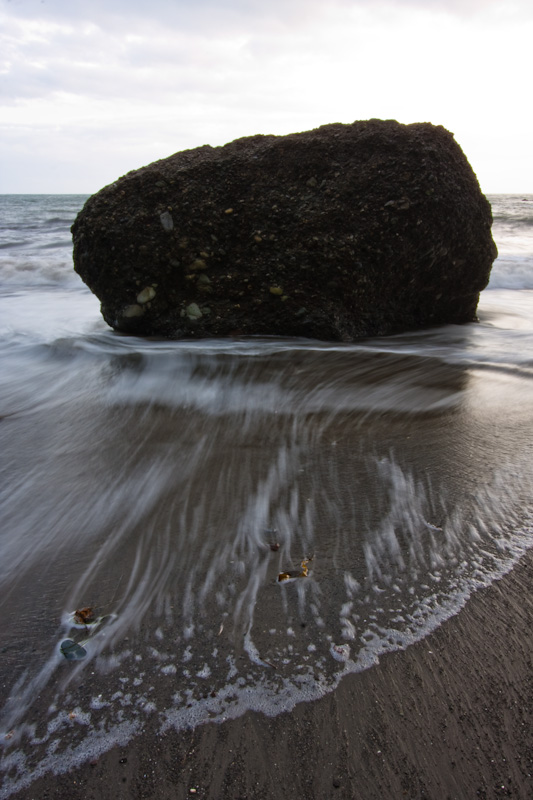 Waves Breaking Around Rock